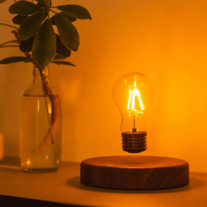 The lamp glowing amber in a dark room
