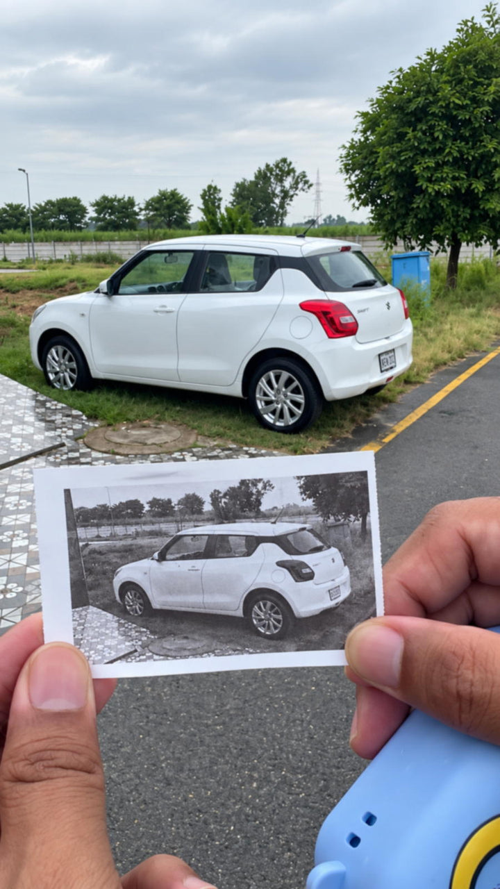 Toy car and its printed photo