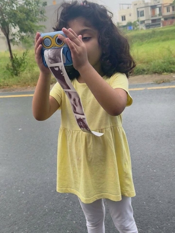 Child outdoors with the camera